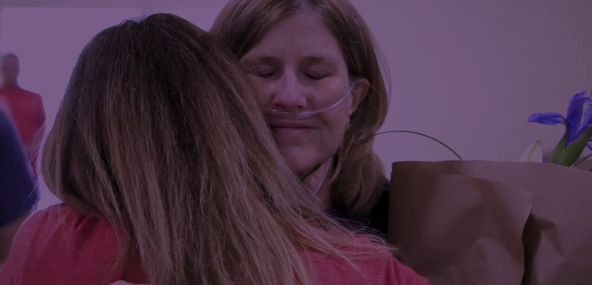 Staff hugging a Hospice patient