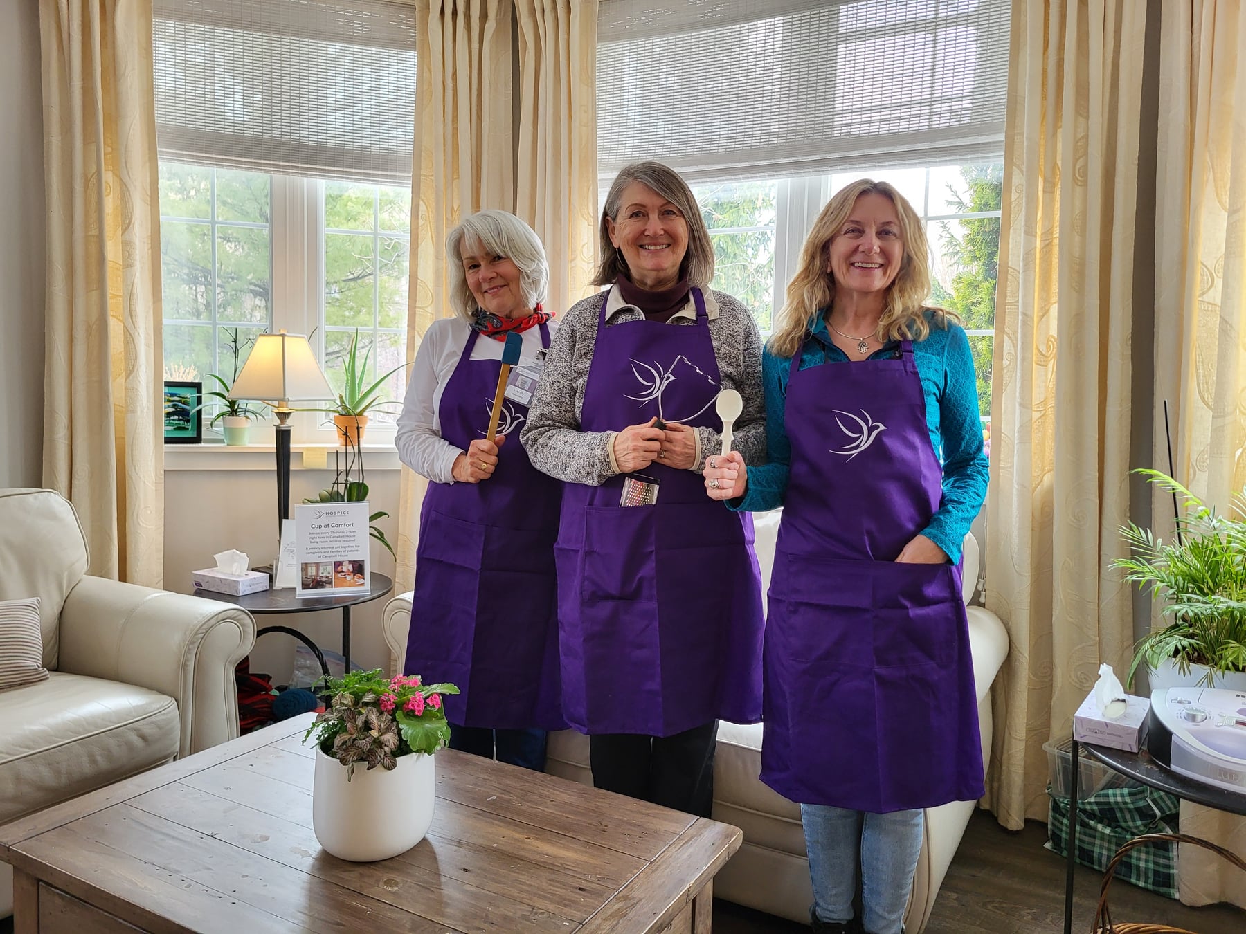 Wendy, Linda and Jeanette wearing their new volunteer aprons