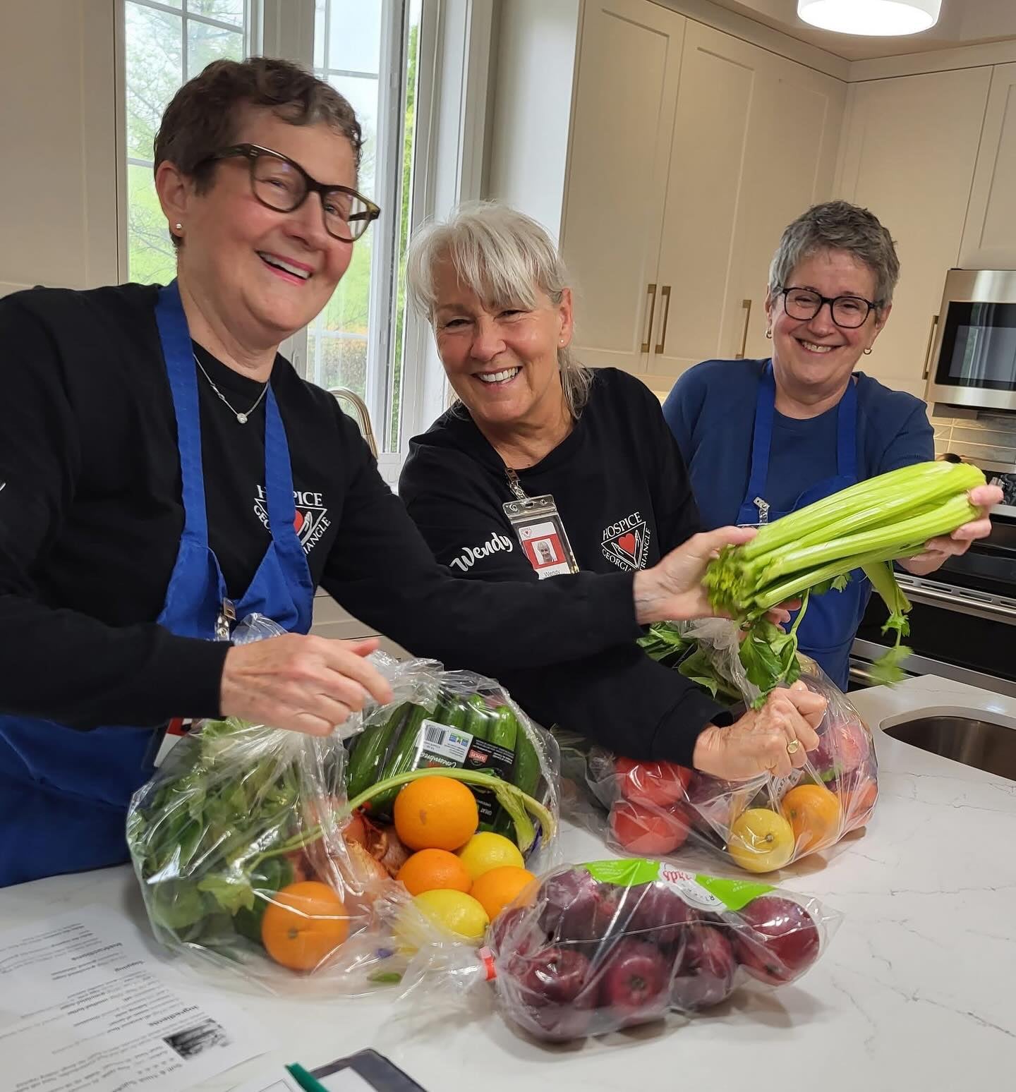 Volunteers preparing food in the Campbell House kitchen