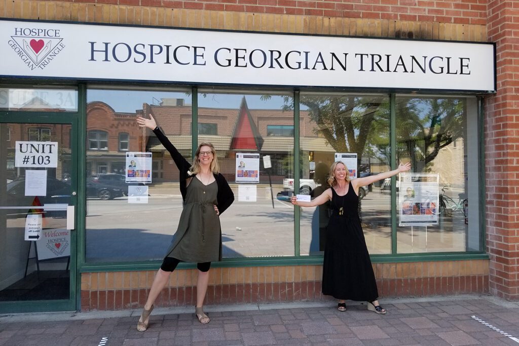 cheque presentation in front of store front